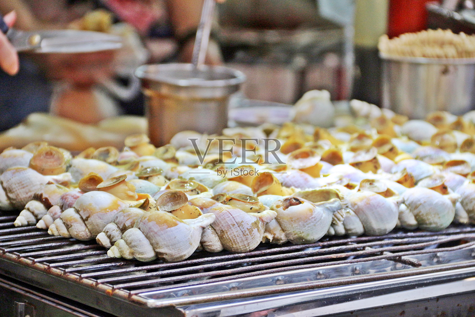 烤海螺照片摄影图片