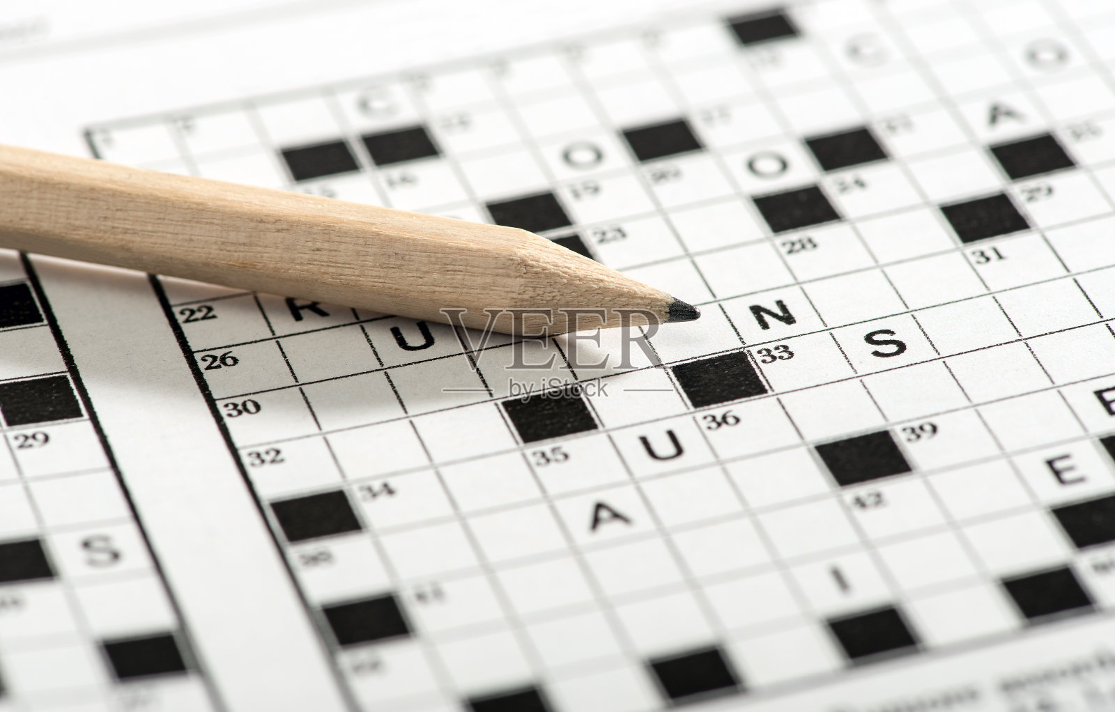 填字游戏纸上的概念铅笔照片摄影图片