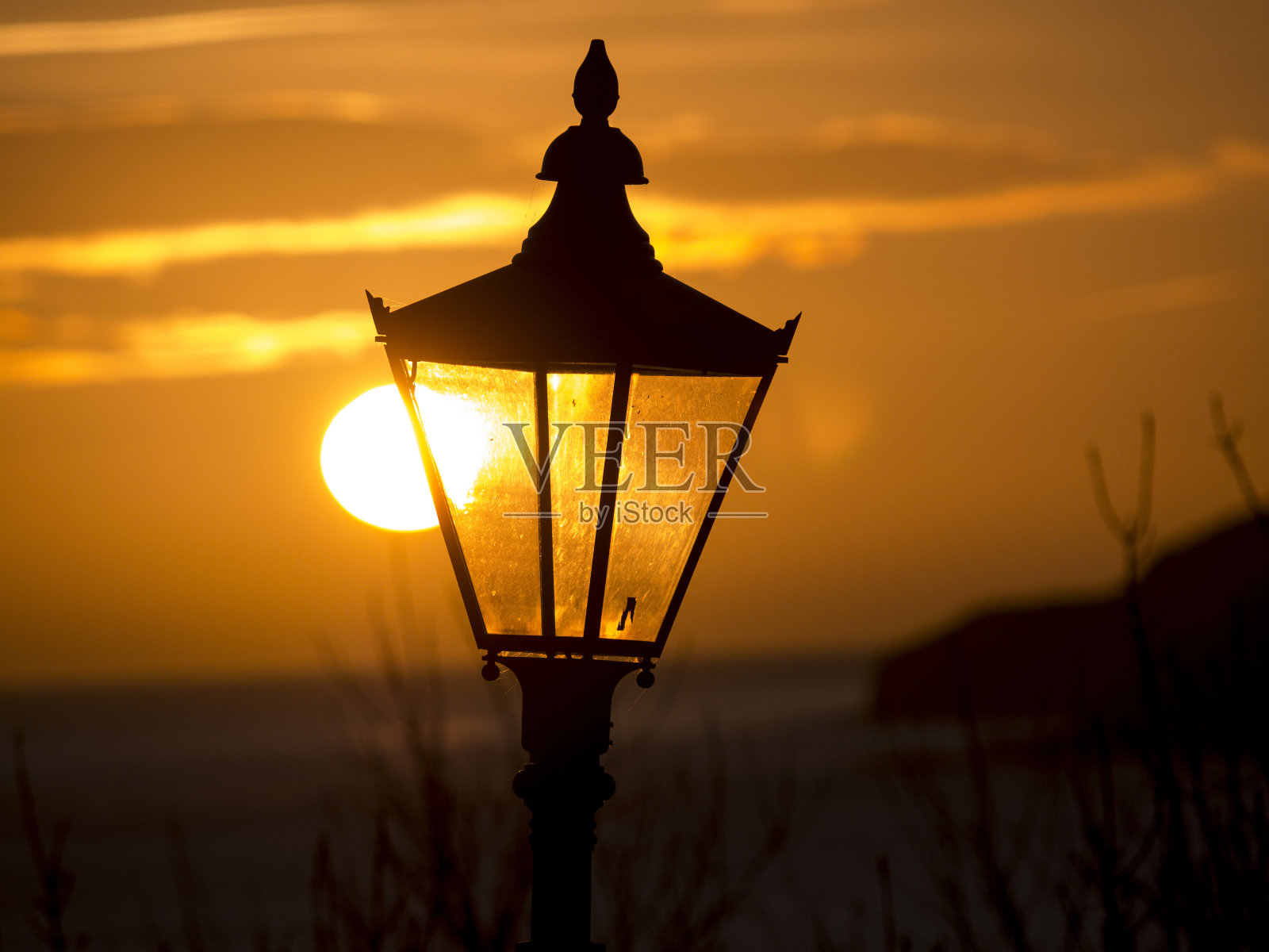 日出时的路灯，英国约克郡罗宾汉湾照片摄影图片