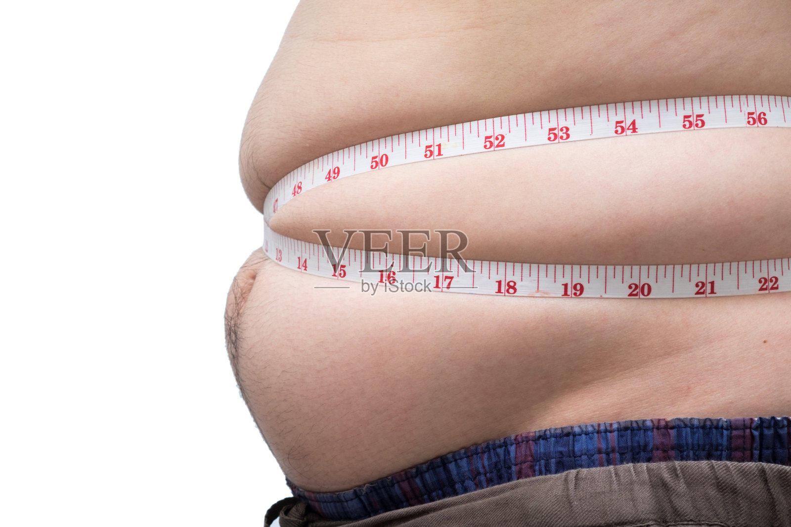 亚洲胖男人用腰围测量他的腹部照片摄影图片