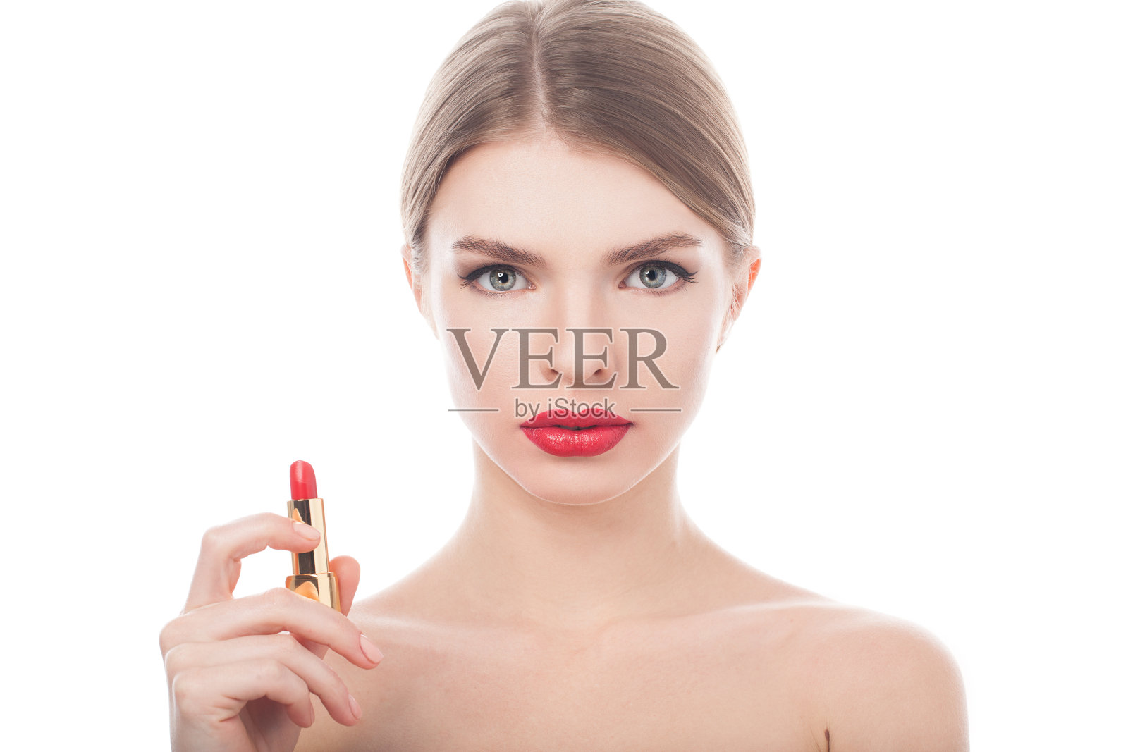 漂亮的女人，漂亮的脸蛋，手上还涂着口红照片摄影图片