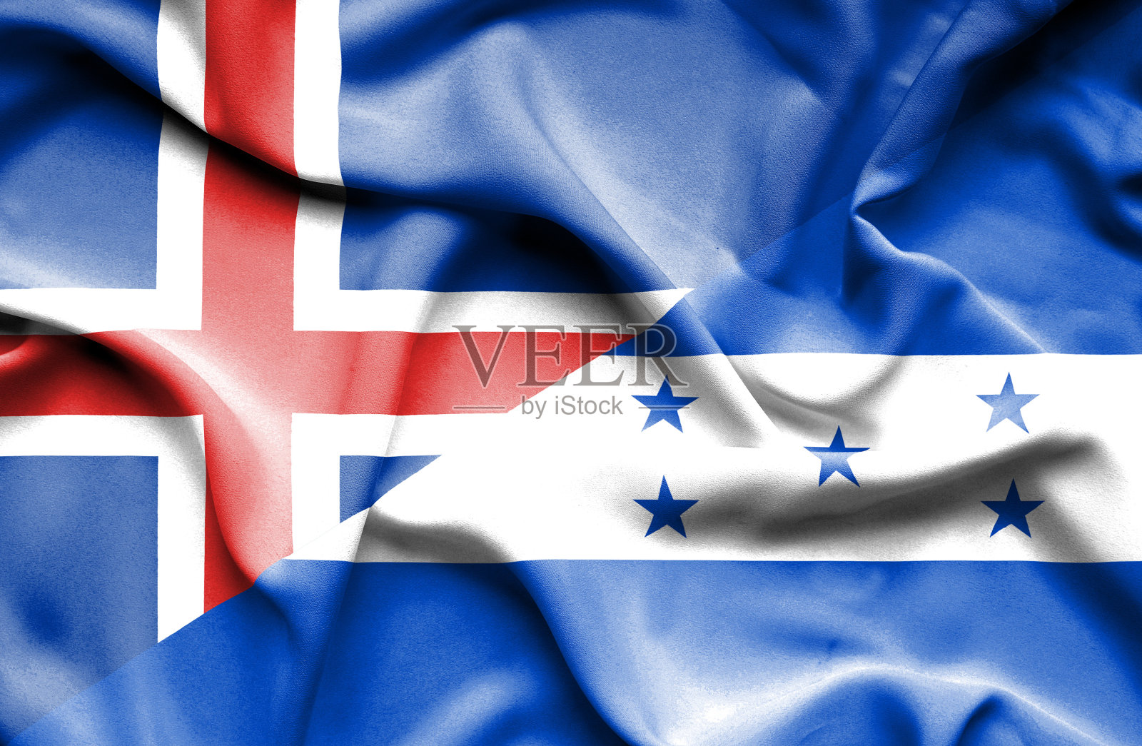 挥舞着洪都拉斯和冰岛的旗帜照片摄影图片