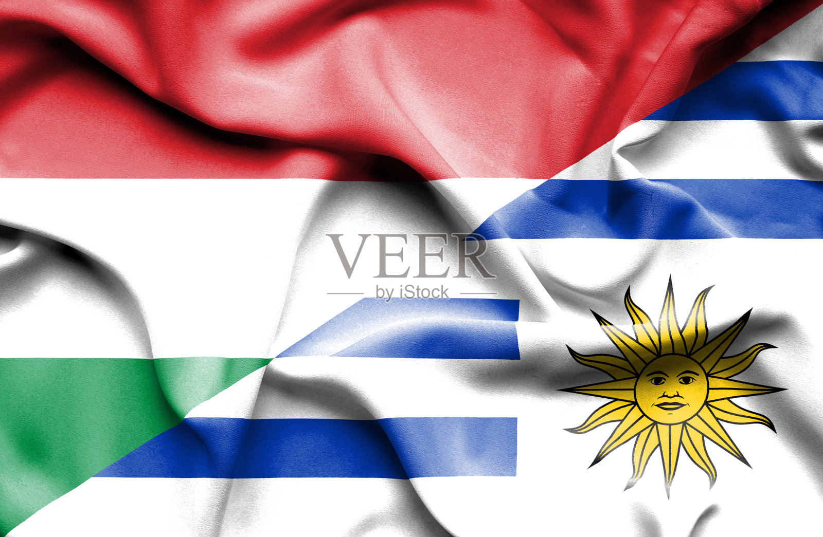 挥舞着乌拉圭和匈牙利的旗帜照片摄影图片