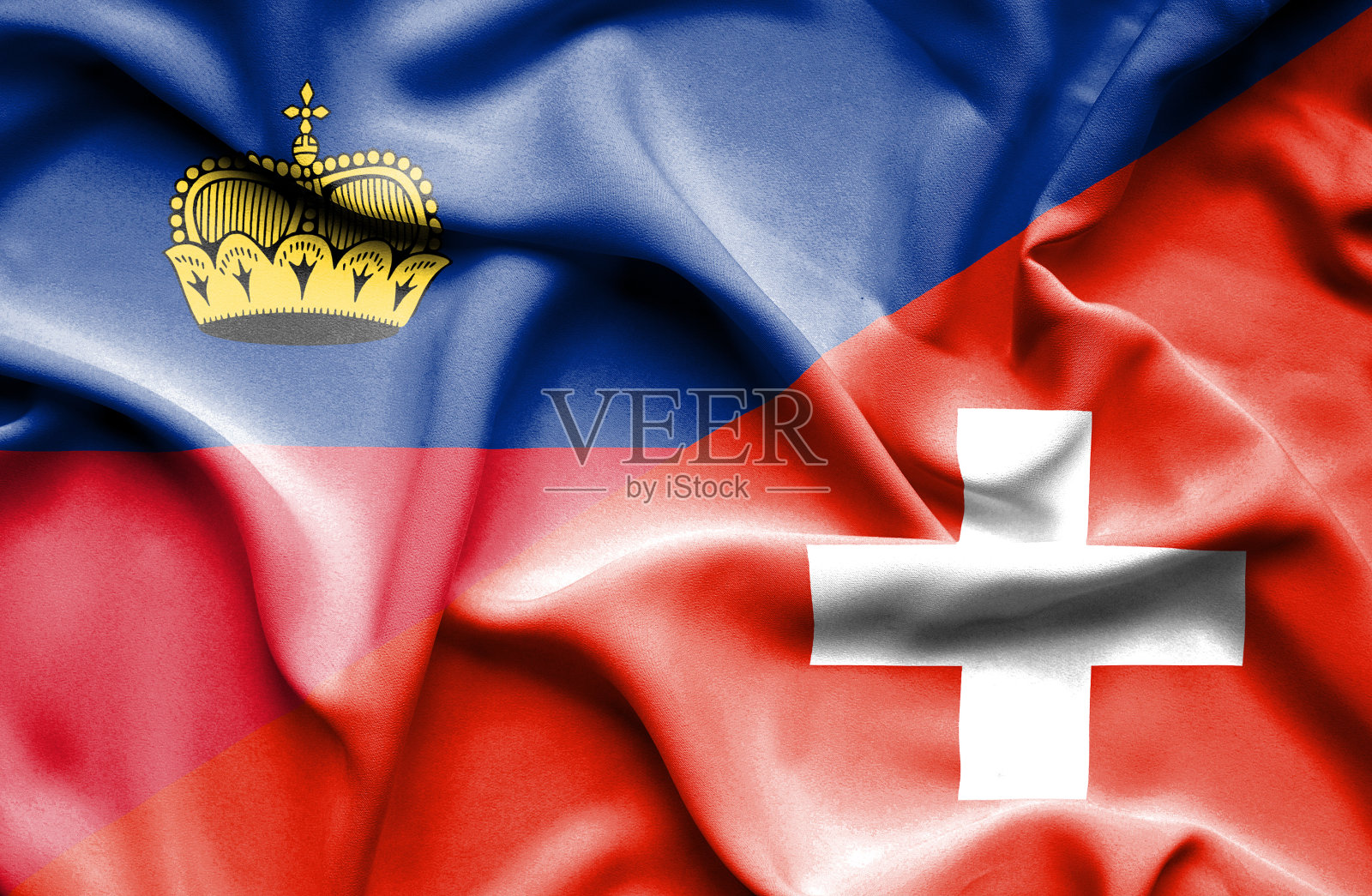 挥舞着瑞士和列支敦士登的旗帜照片摄影图片