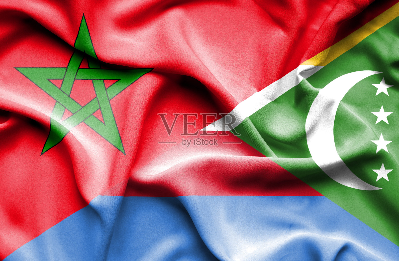 挥舞着科摩罗和摩洛哥的旗帜照片摄影图片