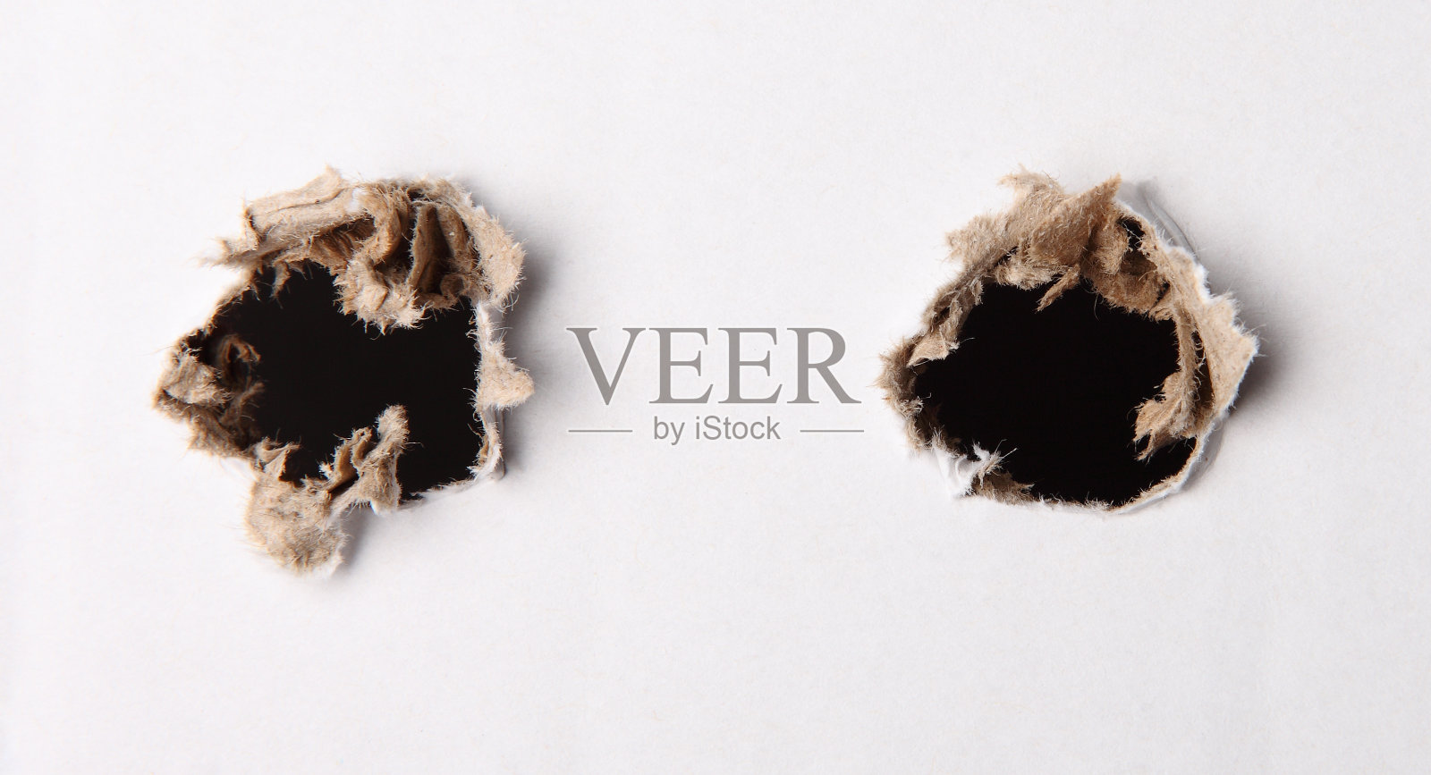 白纸上的洞照片摄影图片