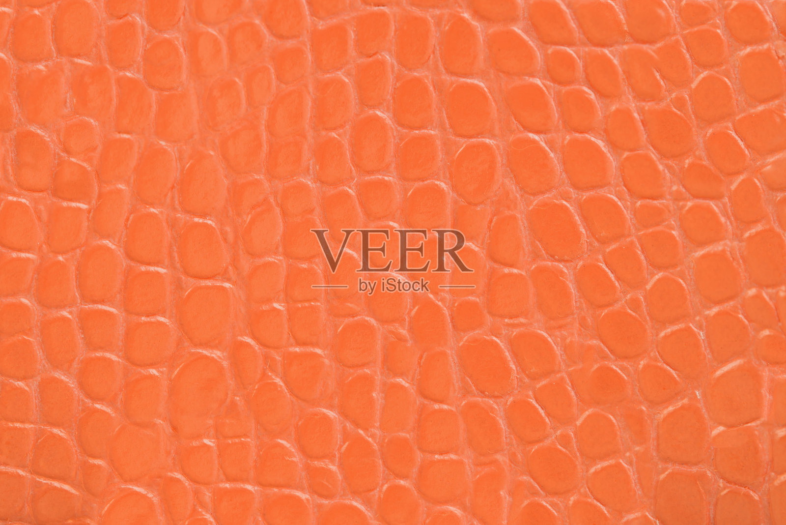 橙色压花皮革纹理背景照片摄影图片