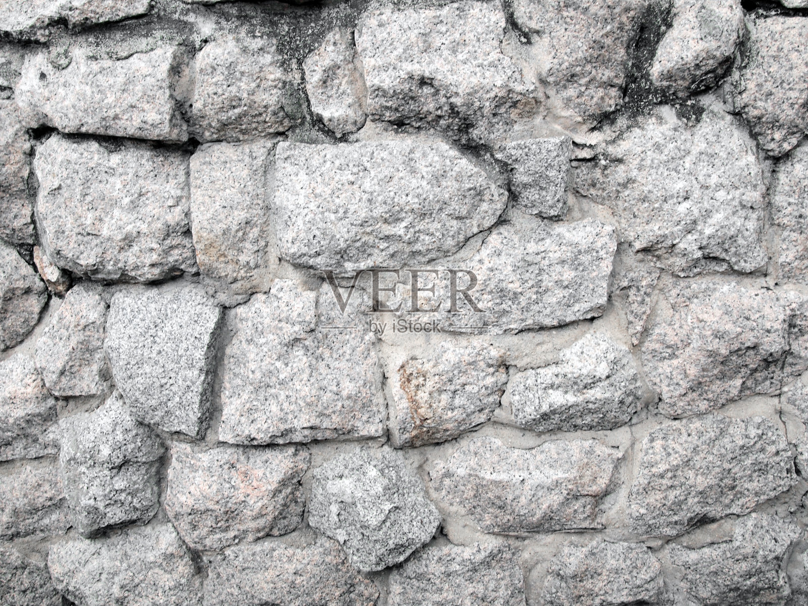 单色拍摄的石墙纹理背景照片摄影图片