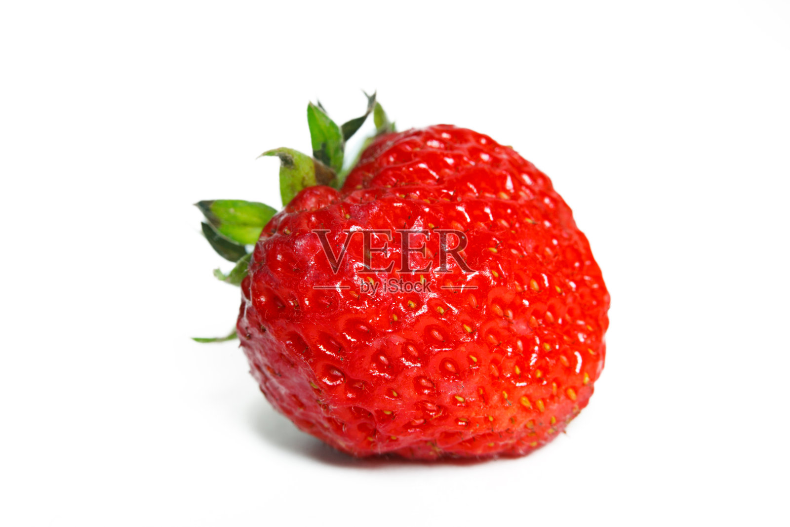 白色背景上的一个草莓照片摄影图片