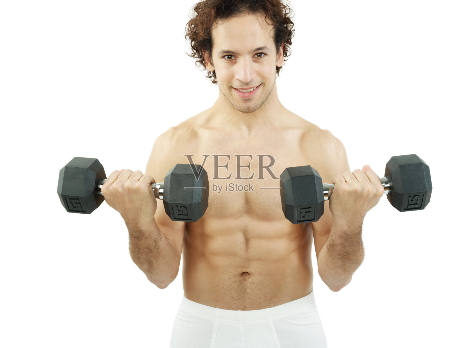 一个穿着内衣拿着哑铃举重的男人照片摄影图片