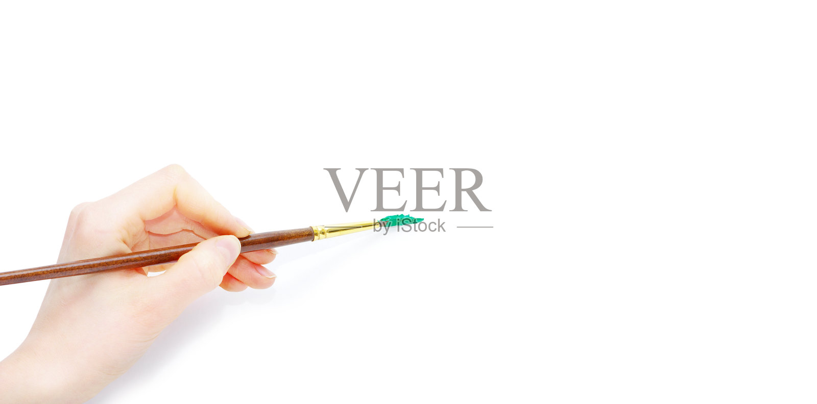 手握刷子的孤立照片照片摄影图片