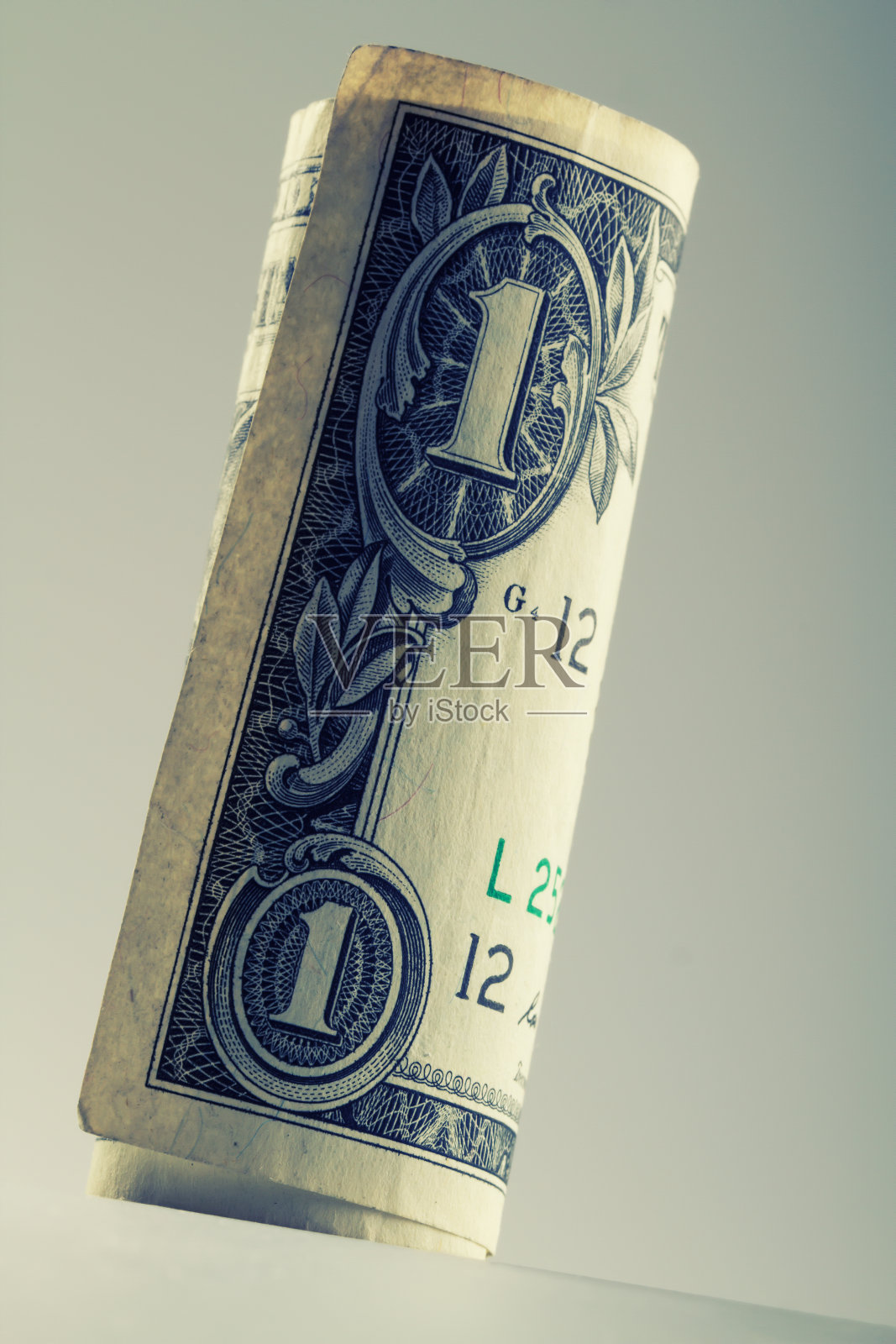 卷了一美元。照片摄影图片