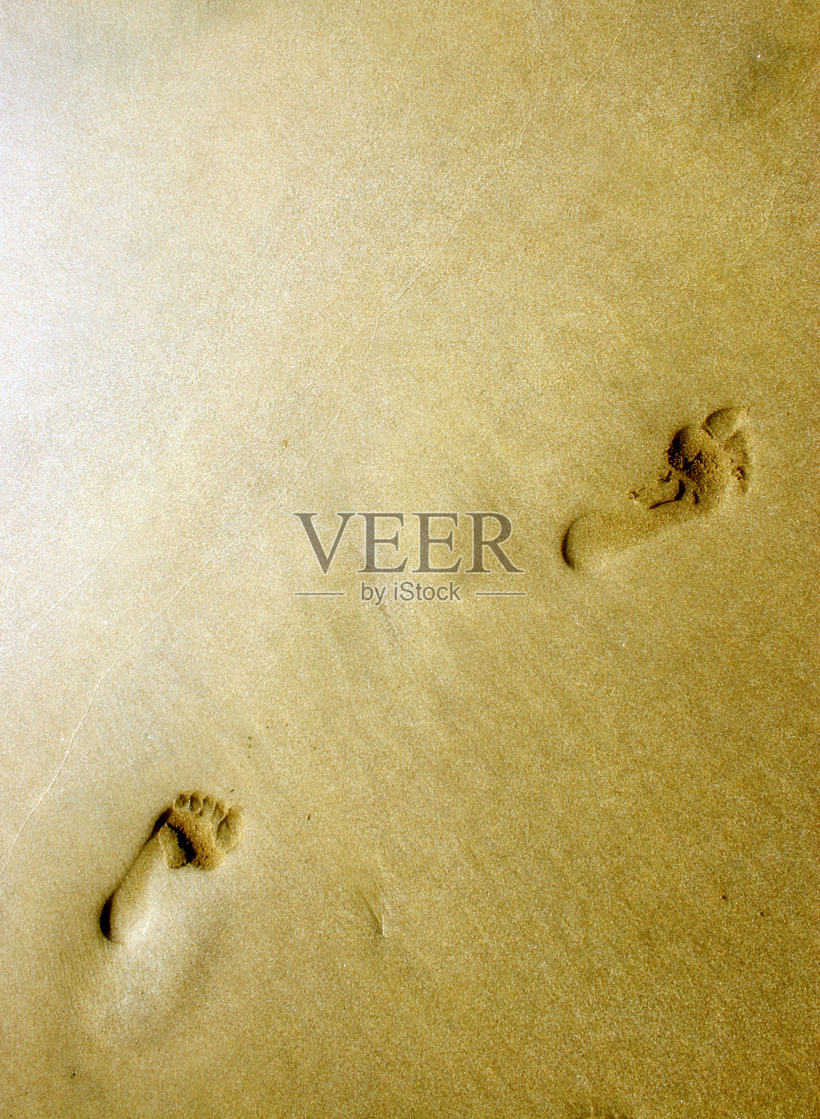 沙滩上的脚印照片摄影图片