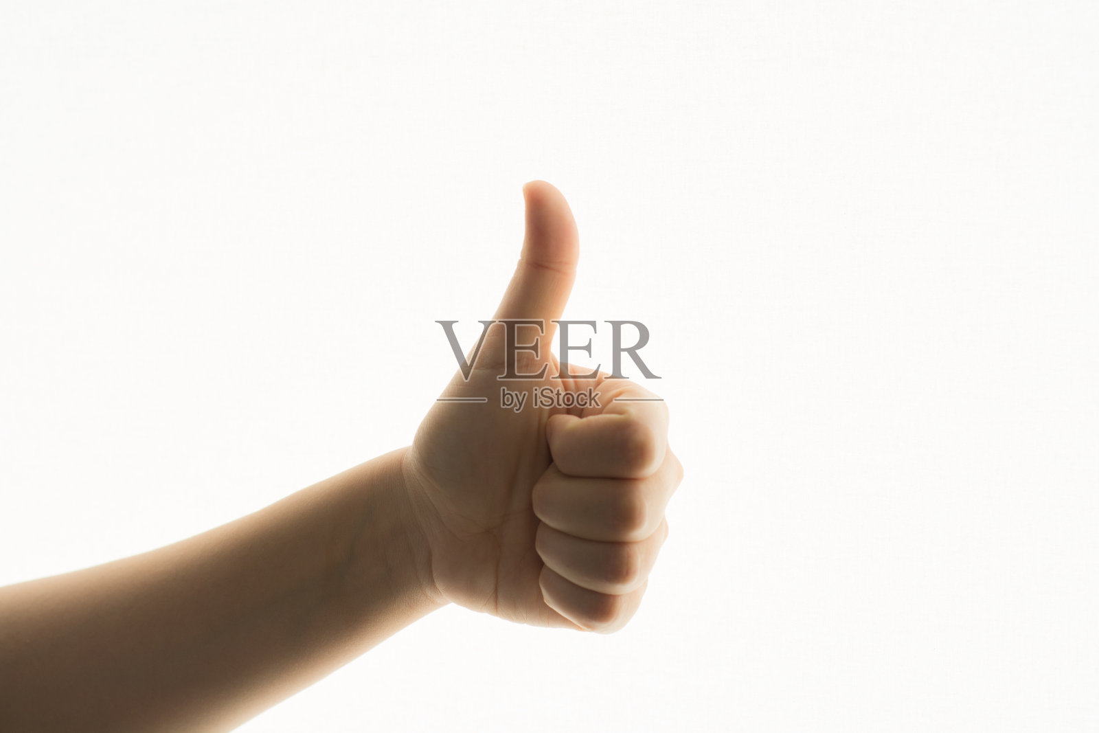 女子双手孤立，竖起大拇指照片摄影图片