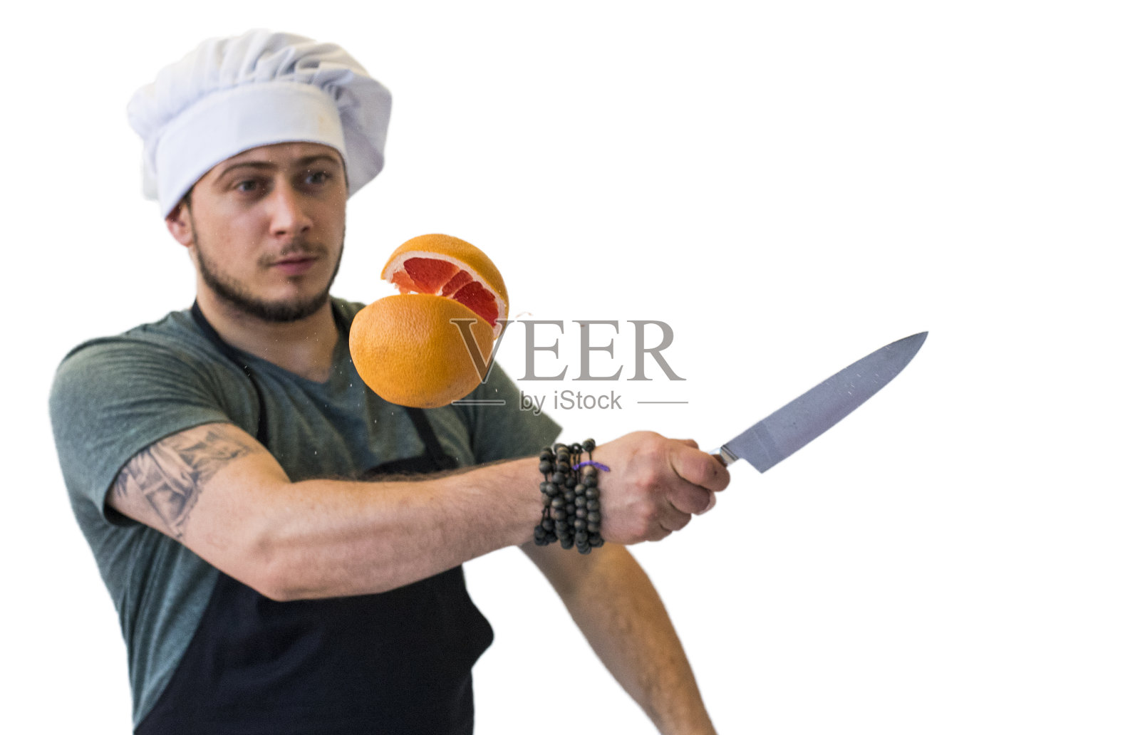 厨师在空中切葡萄柚照片摄影图片