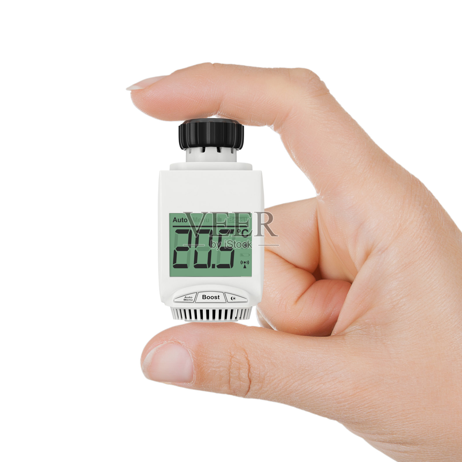 特写女人手握数字无线散热器恒温阀。照片摄影图片