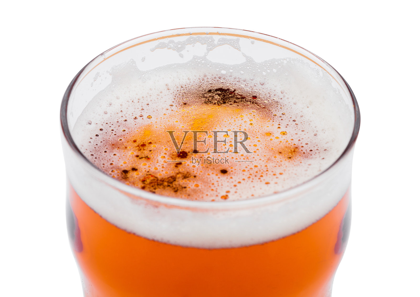 有泡沫的玻璃杯啤酒。从上面看白色照片摄影图片