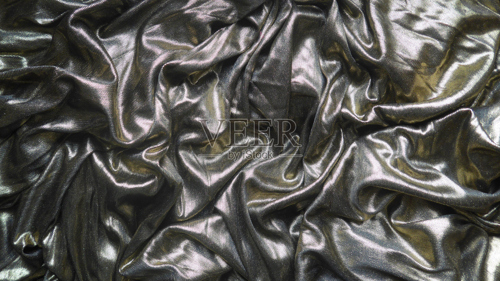 美丽的金属光泽的丝绸或缎面织物照片摄影图片
