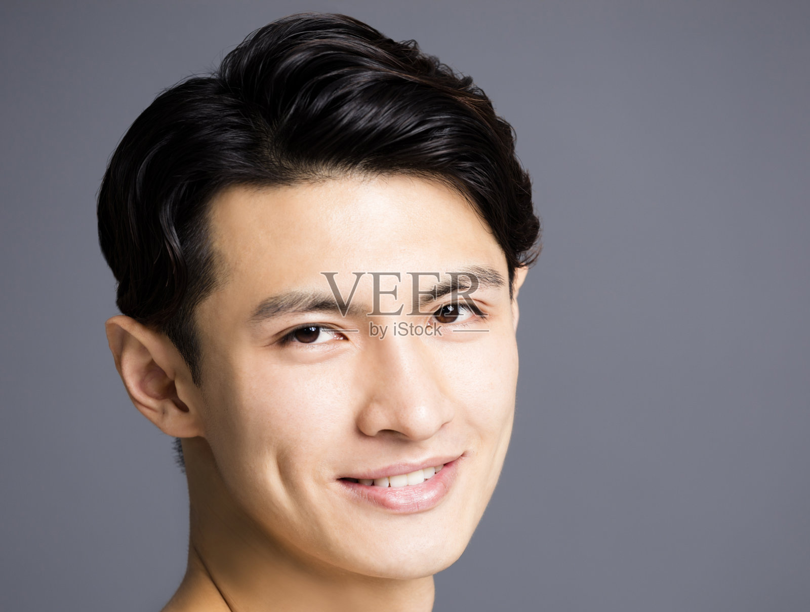 特写英俊的年轻人的脸照片摄影图片