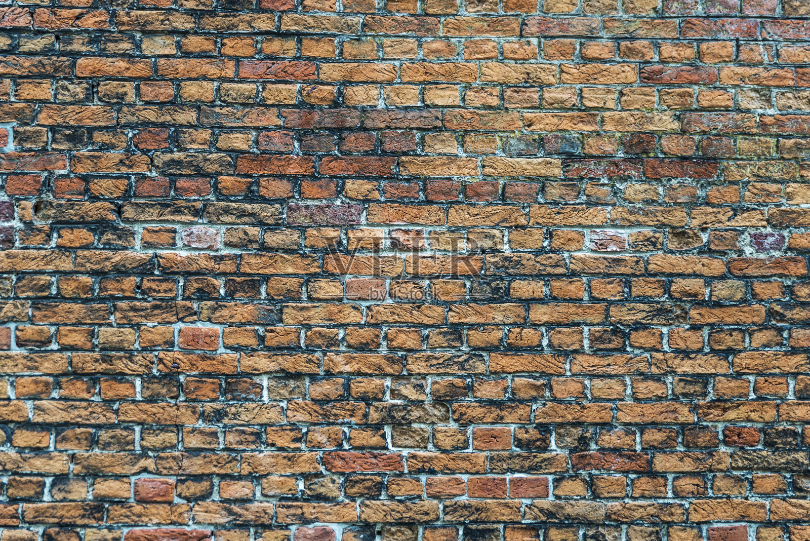 用旧砖砌成的墙作为背景照片摄影图片