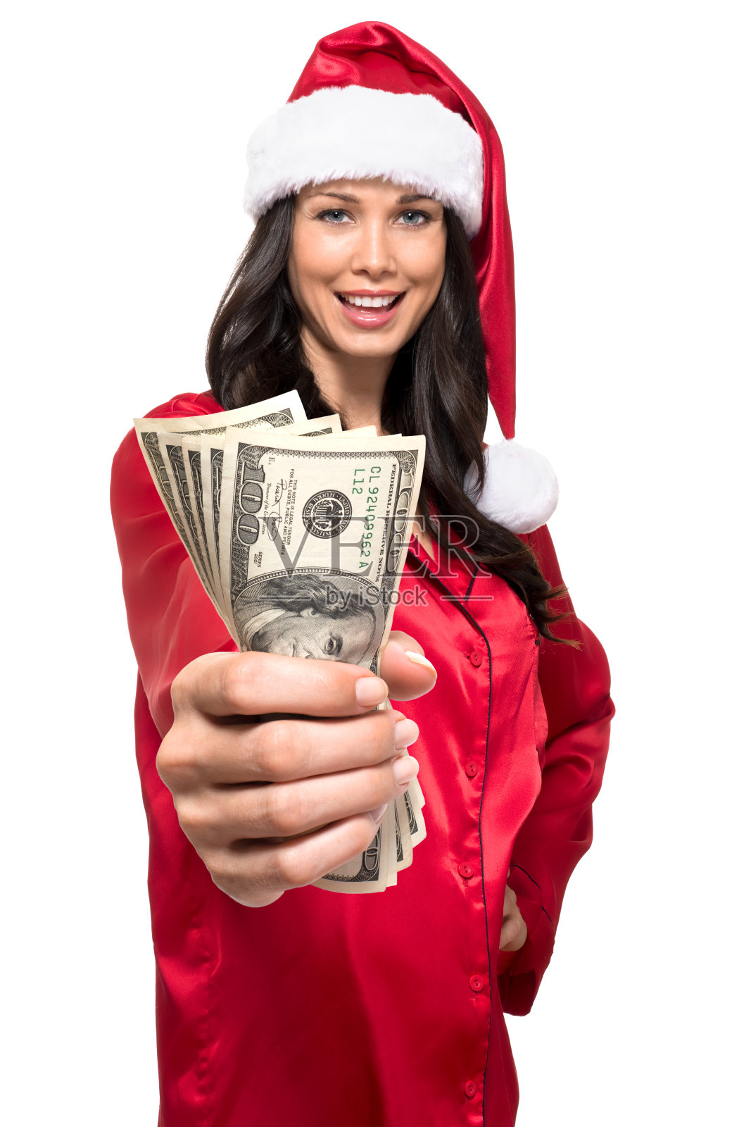 戴着圣诞帽的女人，现金在白色背景上被隔离照片摄影图片