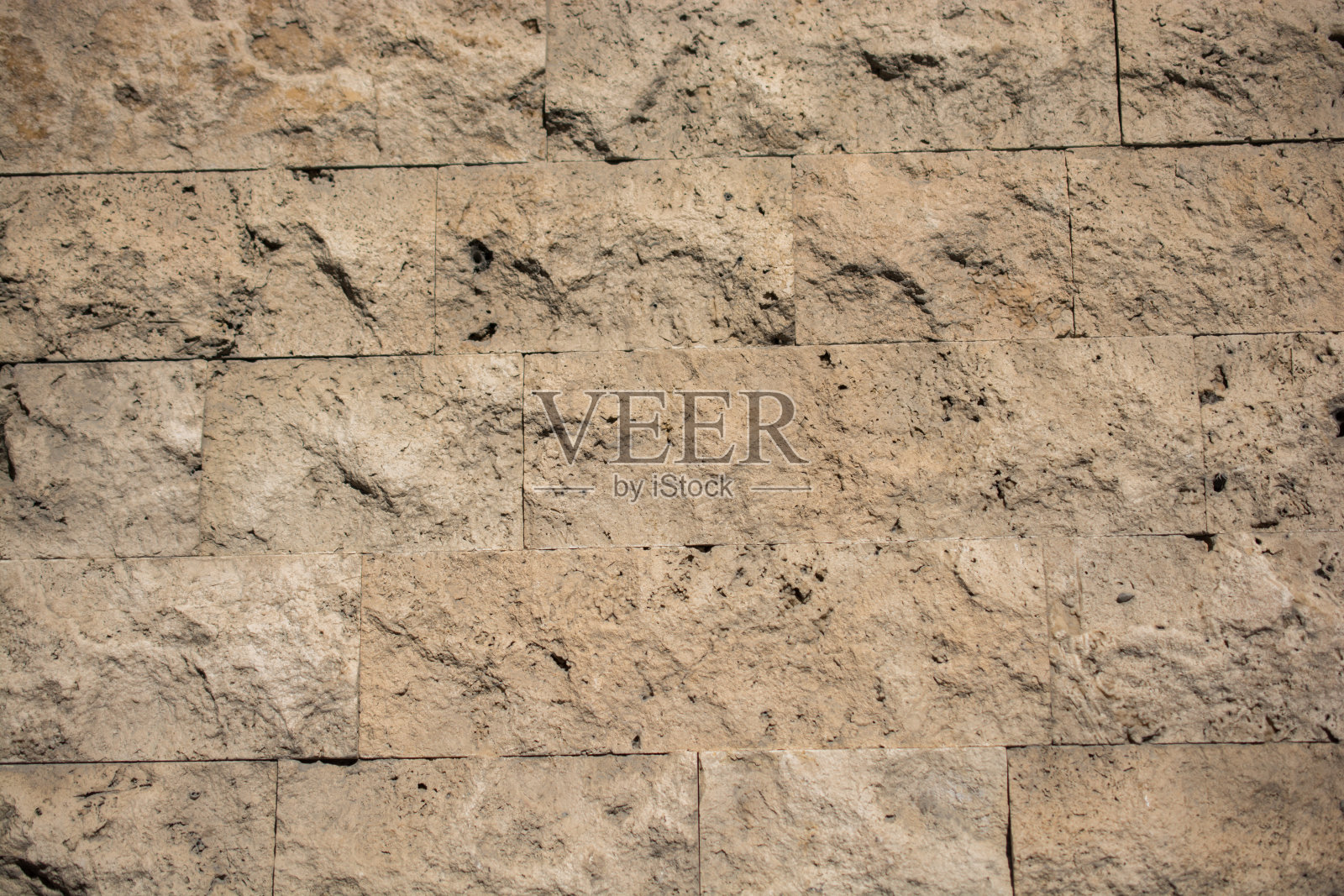 用同一种石头砌成的墙照片摄影图片