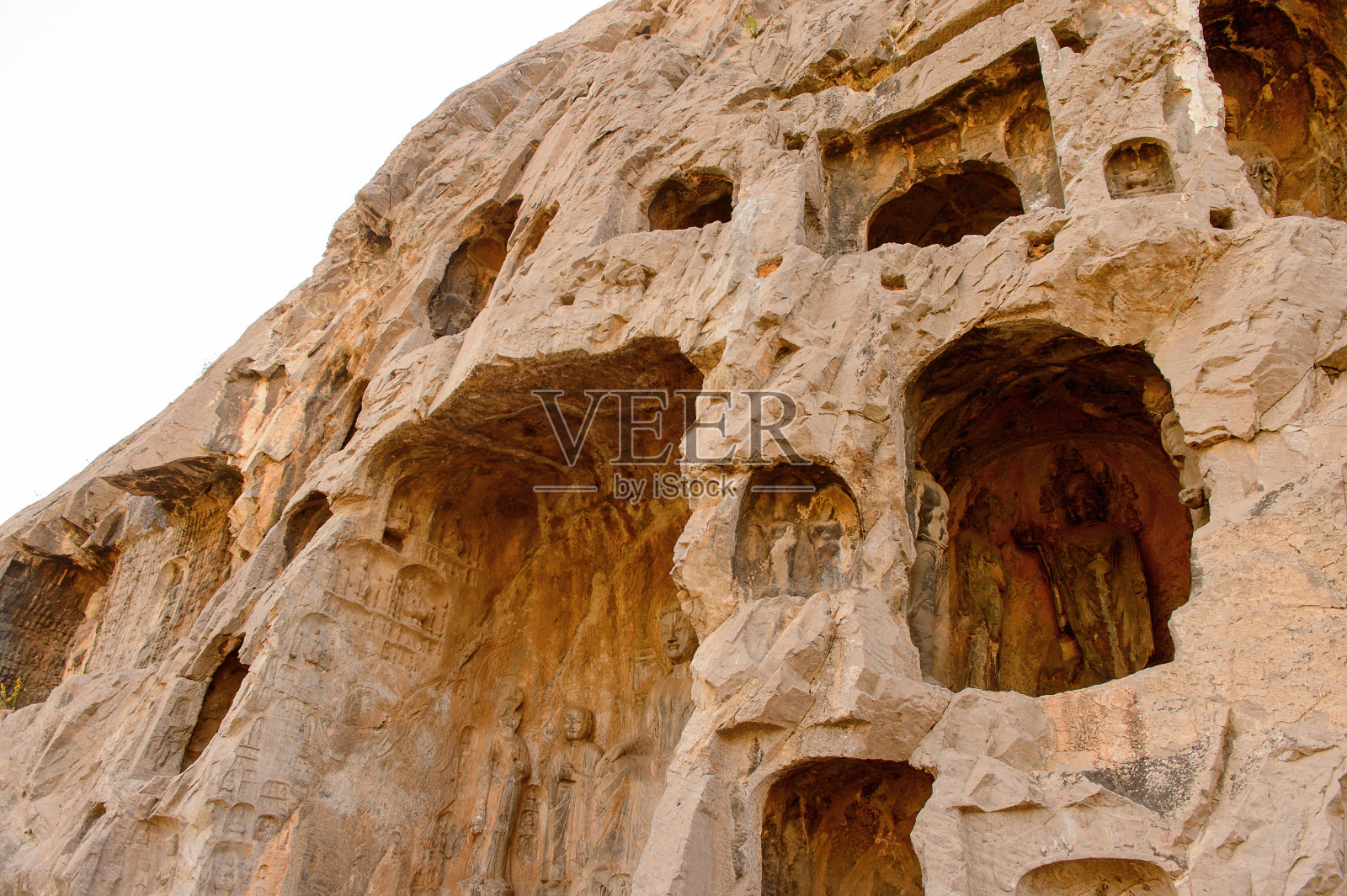 龙门石窟(龙门石窟)或龙门石窟。联合国教科文组织世界遗产，有成千上万的佛像和他的弟子照片摄影图片