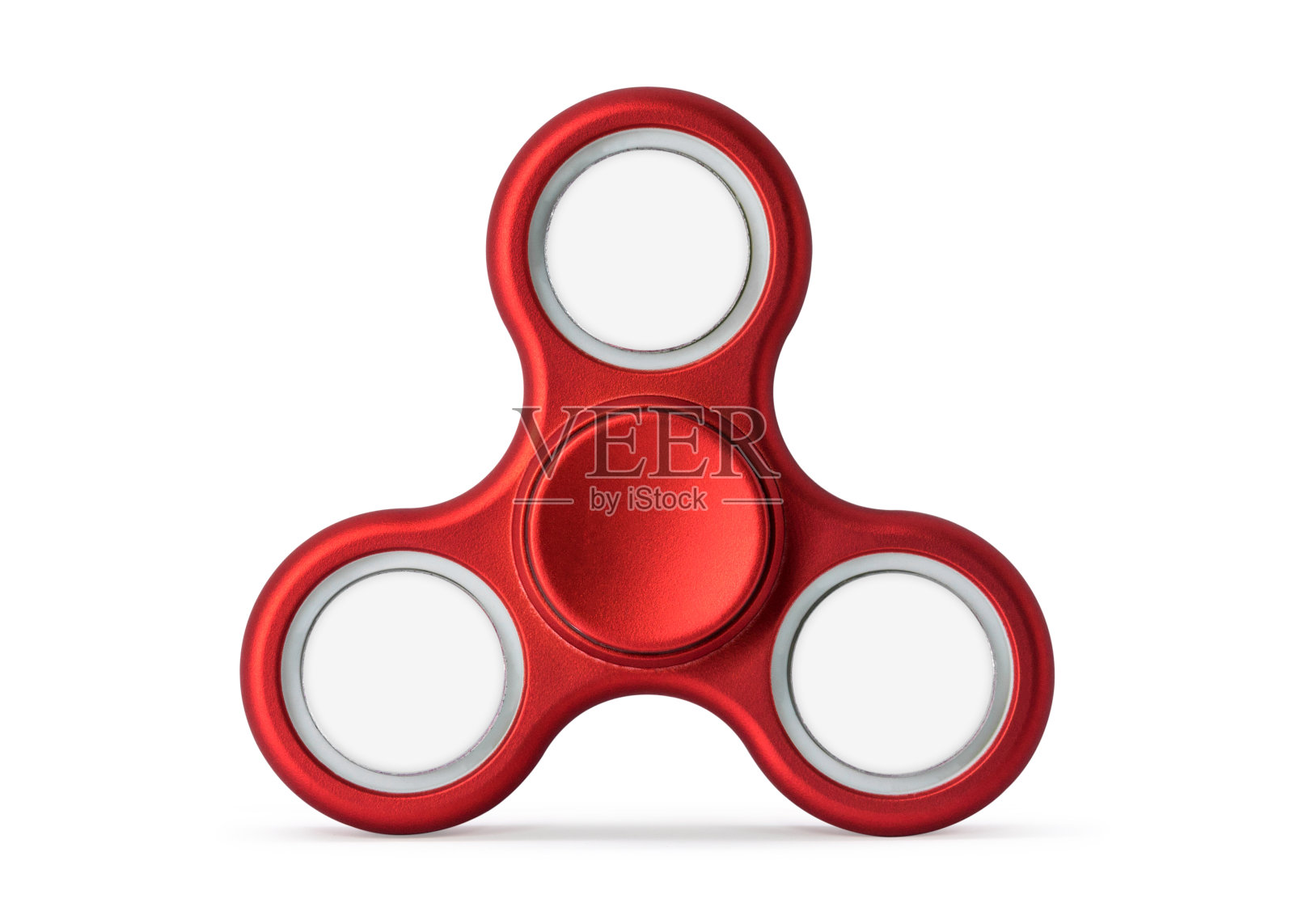 红色指尖陀螺，白色背景隔离。缓解压力的玩具。（带有剪切路径或抠图对象，用于蒙太奇）可以放置文字、图像和logo。照片摄影图片