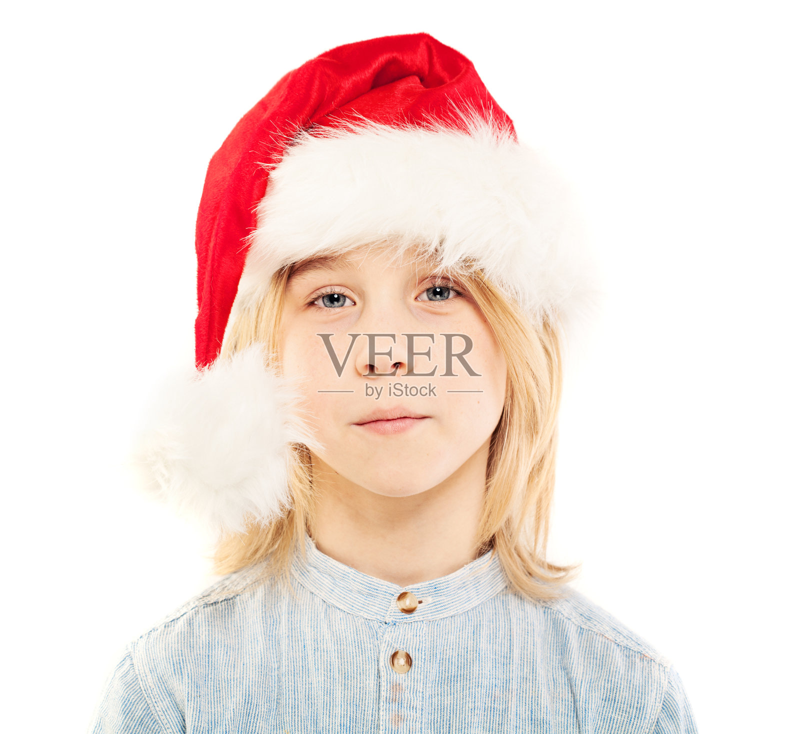 小男孩在圣诞帽孤立。圣诞节的孩子照片摄影图片