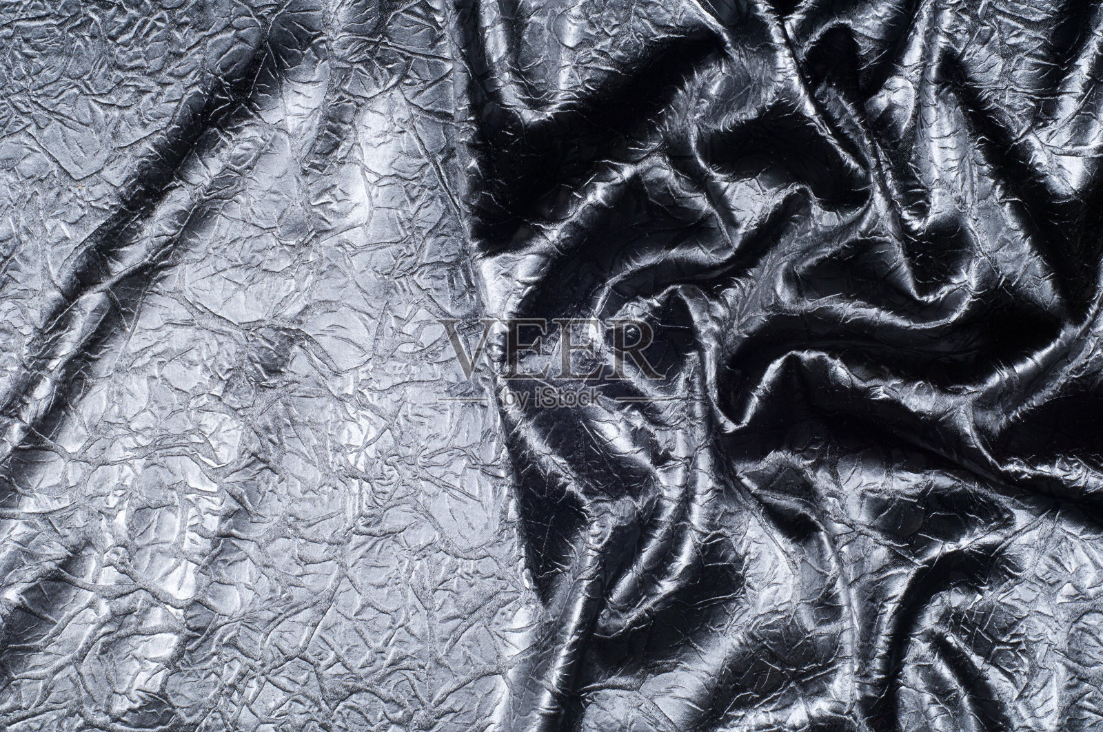 面料质地丝质黑色。与灰色斑点。抽象照片摄影图片