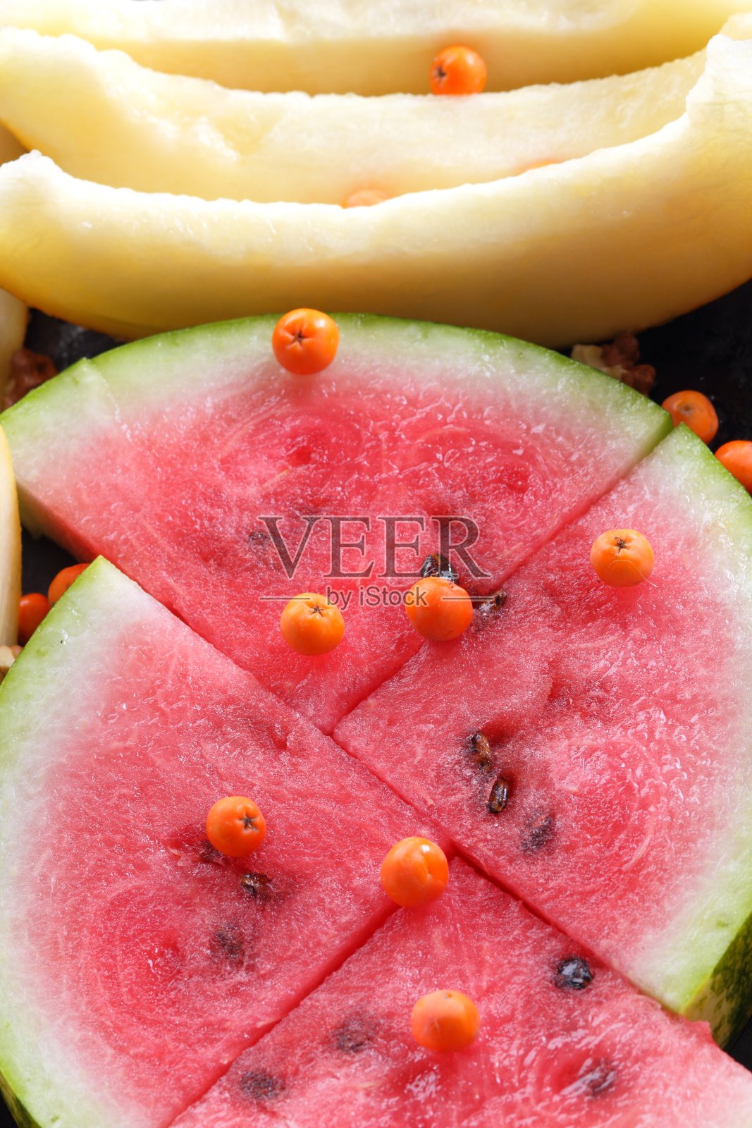 许多块瓜和西瓜与山灰浆果为设计师照片摄影图片