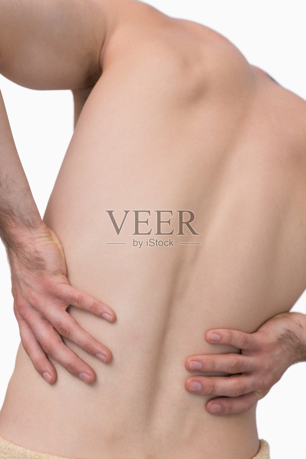 背部疼痛的赤膊男子的后视图照片摄影图片