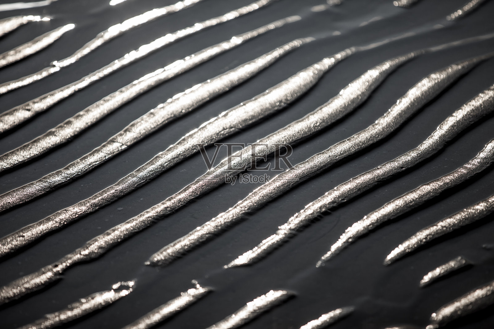 湿沙上的波纹的高角度视图照片摄影图片