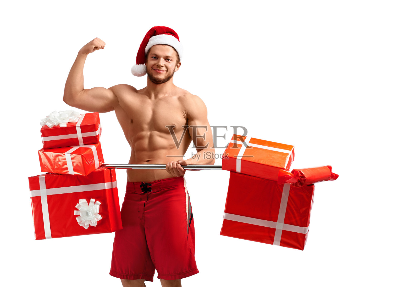 性感的圣诞老人露出他的二头肌照片摄影图片