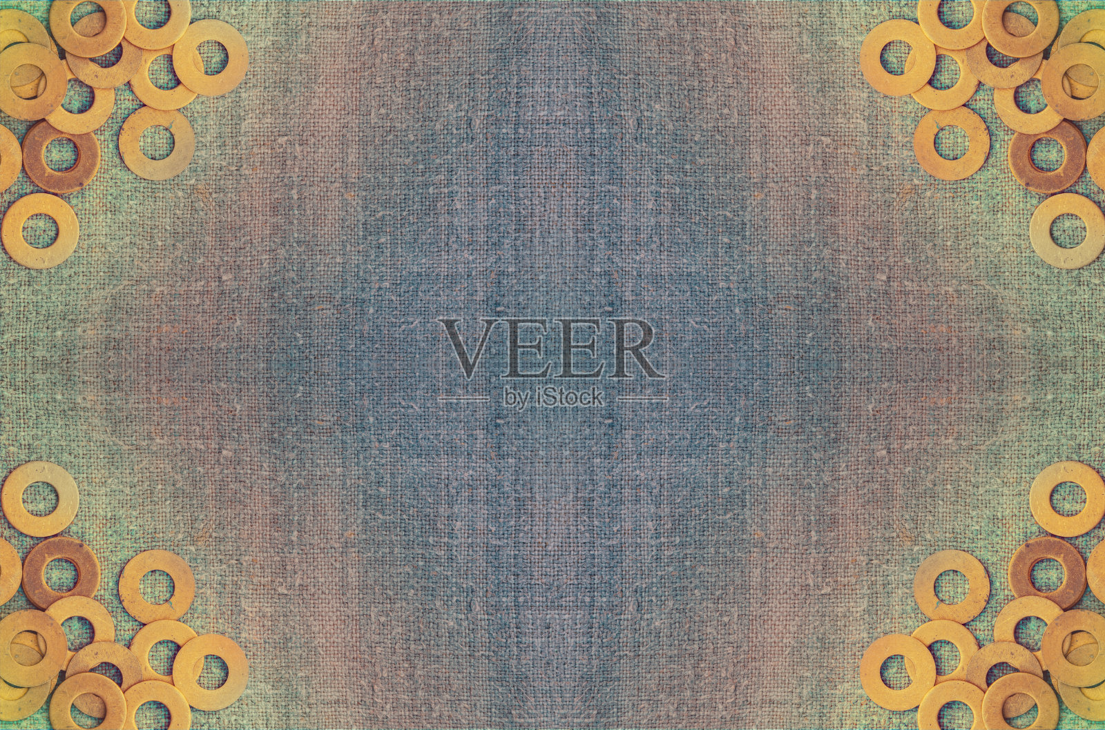 抽象枯燥乏味的背景。粗麻布上的金属环垫圈照片摄影图片