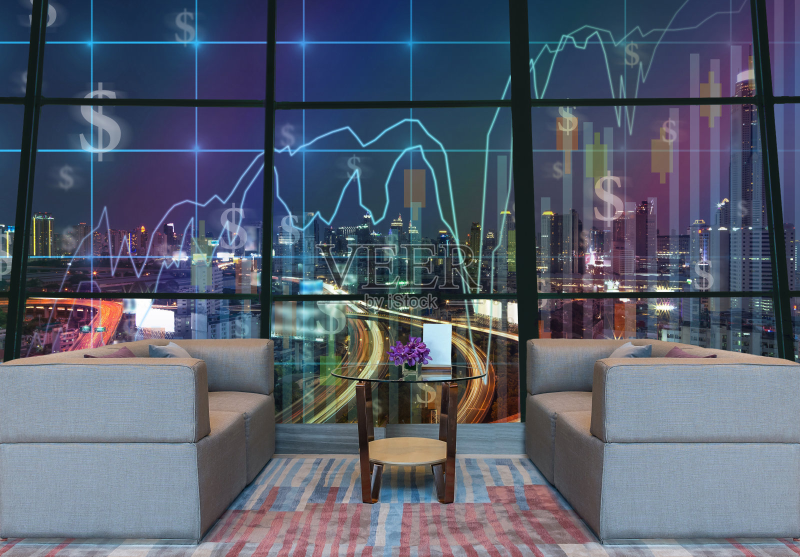 酒店大堂区域，可以在夜间的城市景观背景上看到贸易图，商业金融概念照片摄影图片