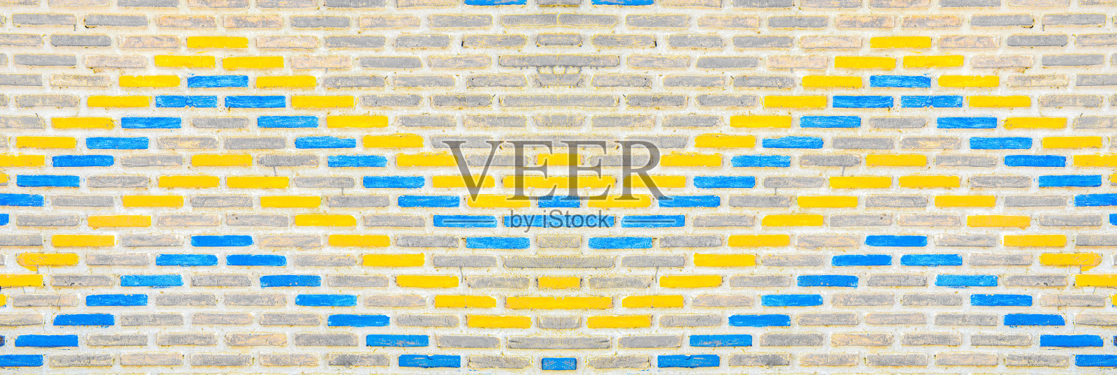 彩色砖墙背景。照片摄影图片