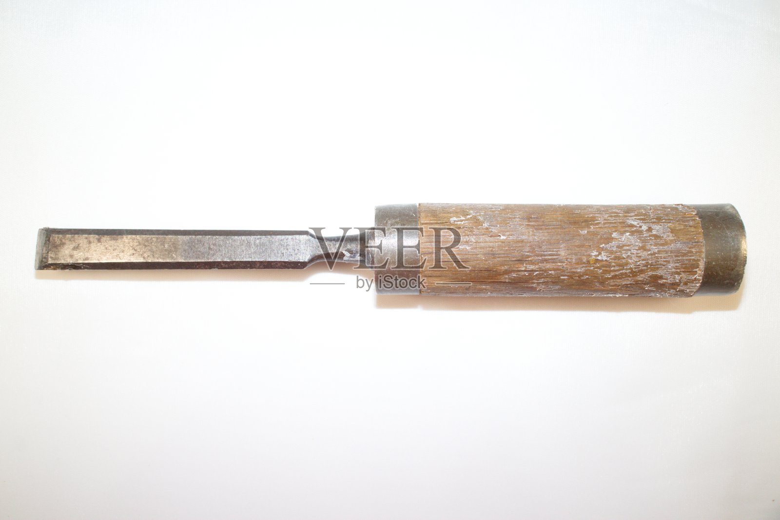 白色背景上有强力木柄的工具凿子照片摄影图片