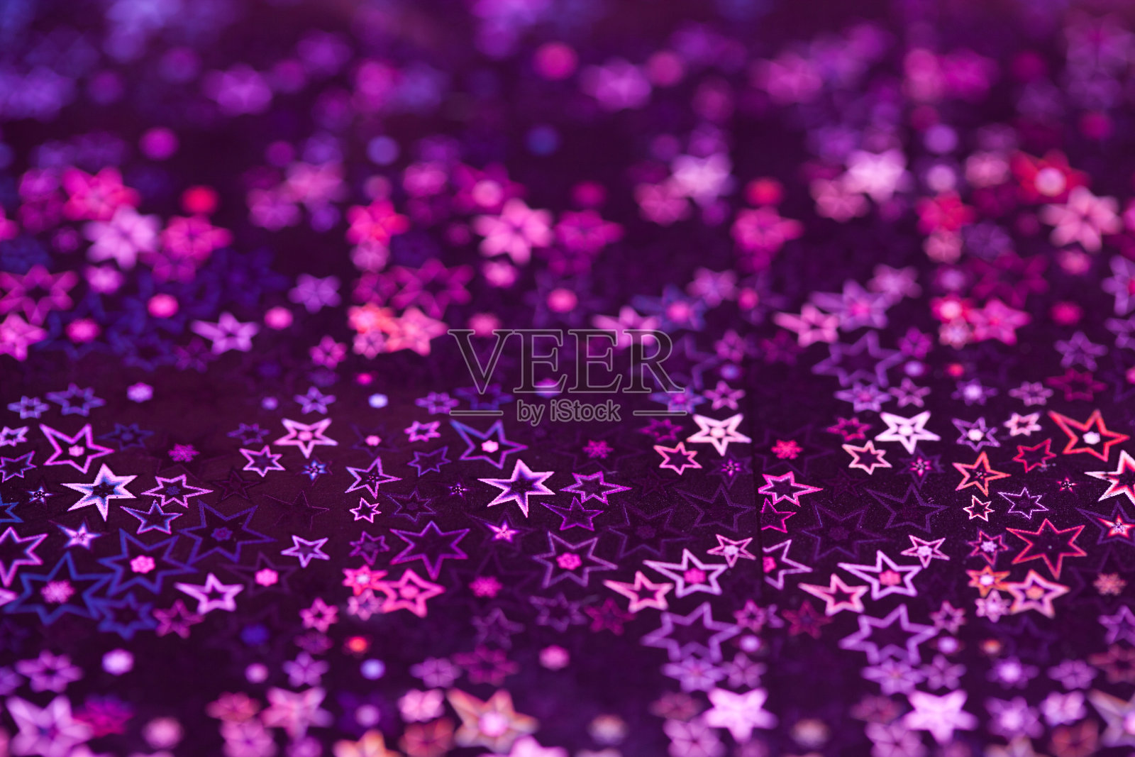 紫外全息图案，特写。星星照片摄影图片