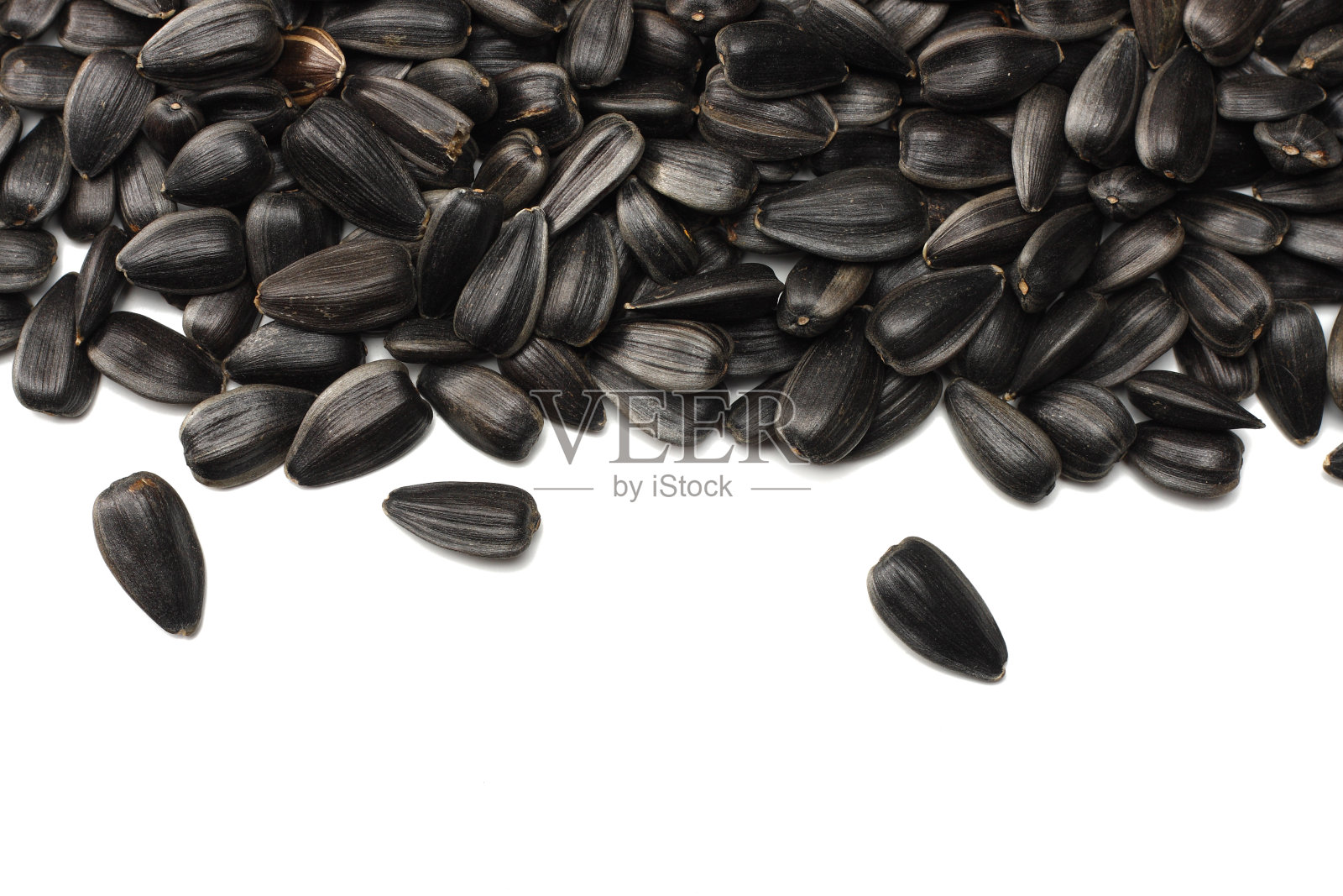 白色背景上的向日葵籽，顶部视角照片摄影图片