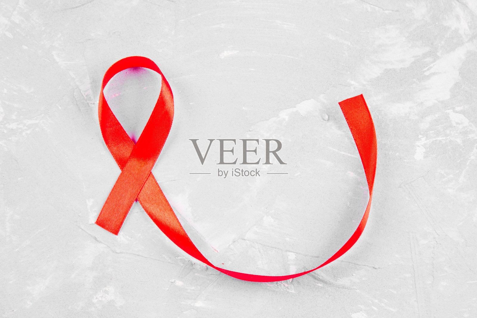 红丝带意识为世界艾滋病日的概念。照片摄影图片