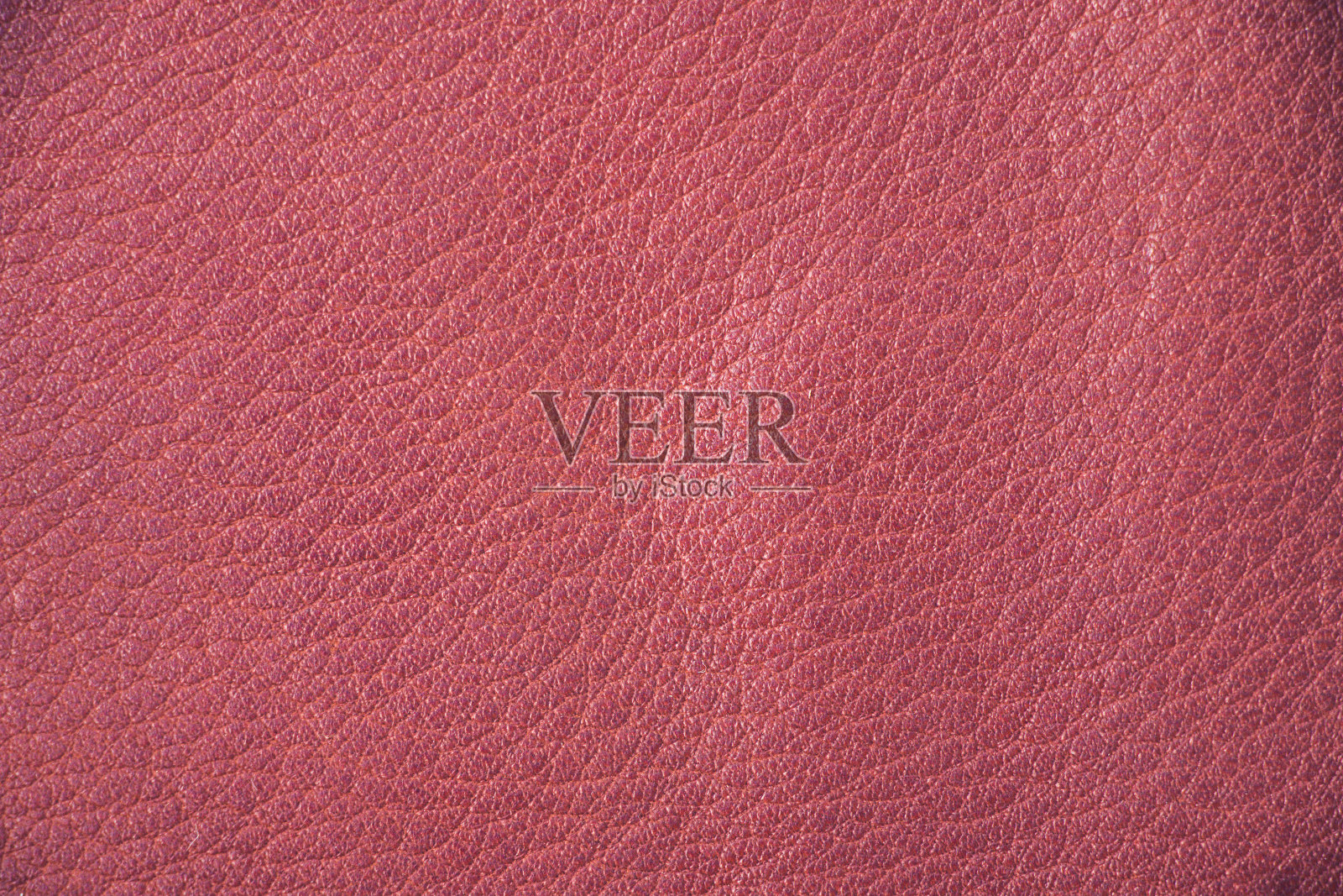 红色皮革纹理背景。照片摄影图片