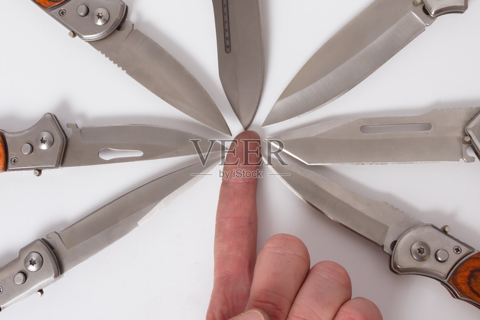 手指手折叠刀八个刀片向内。照片摄影图片