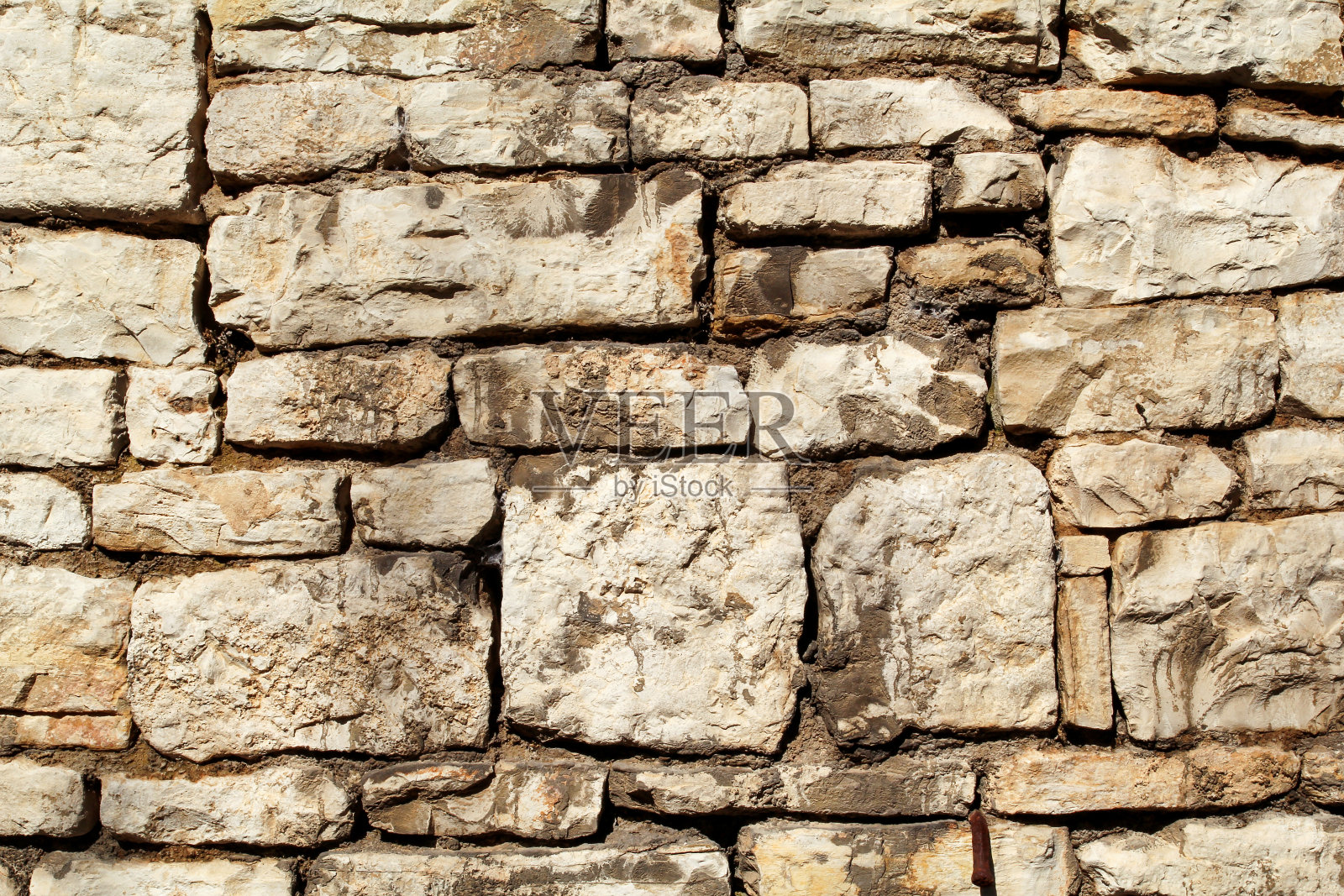 砖石墙部分自然对比石材花岗岩是一种纹理的图案，材质和背景以彩石/老砖墙作为背景墙纸，近/石材进行排列。照片摄影图片