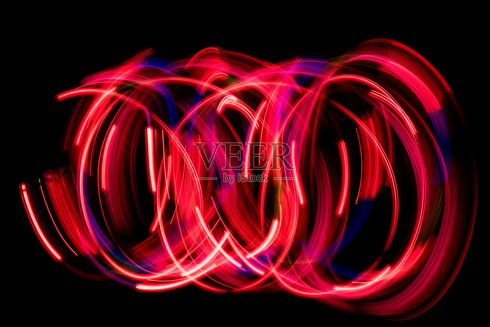 红色抽象光画。黑色背景上的LED灯照片摄影图片