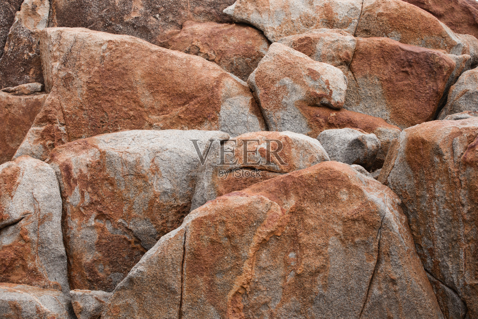 海滩上的岩石，石头纹理特写照片摄影图片
