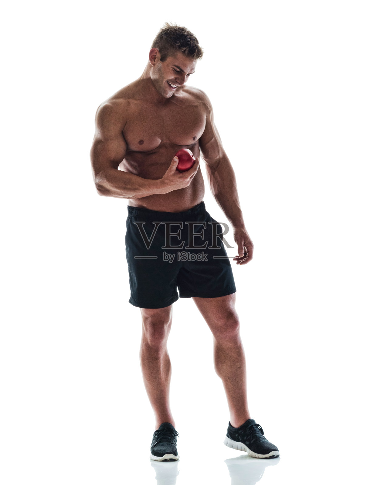 有魅力的赤膊男拿着苹果照片摄影图片