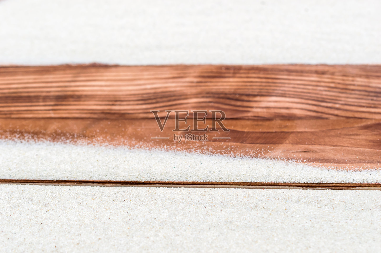 木板上的沙子。照片摄影图片