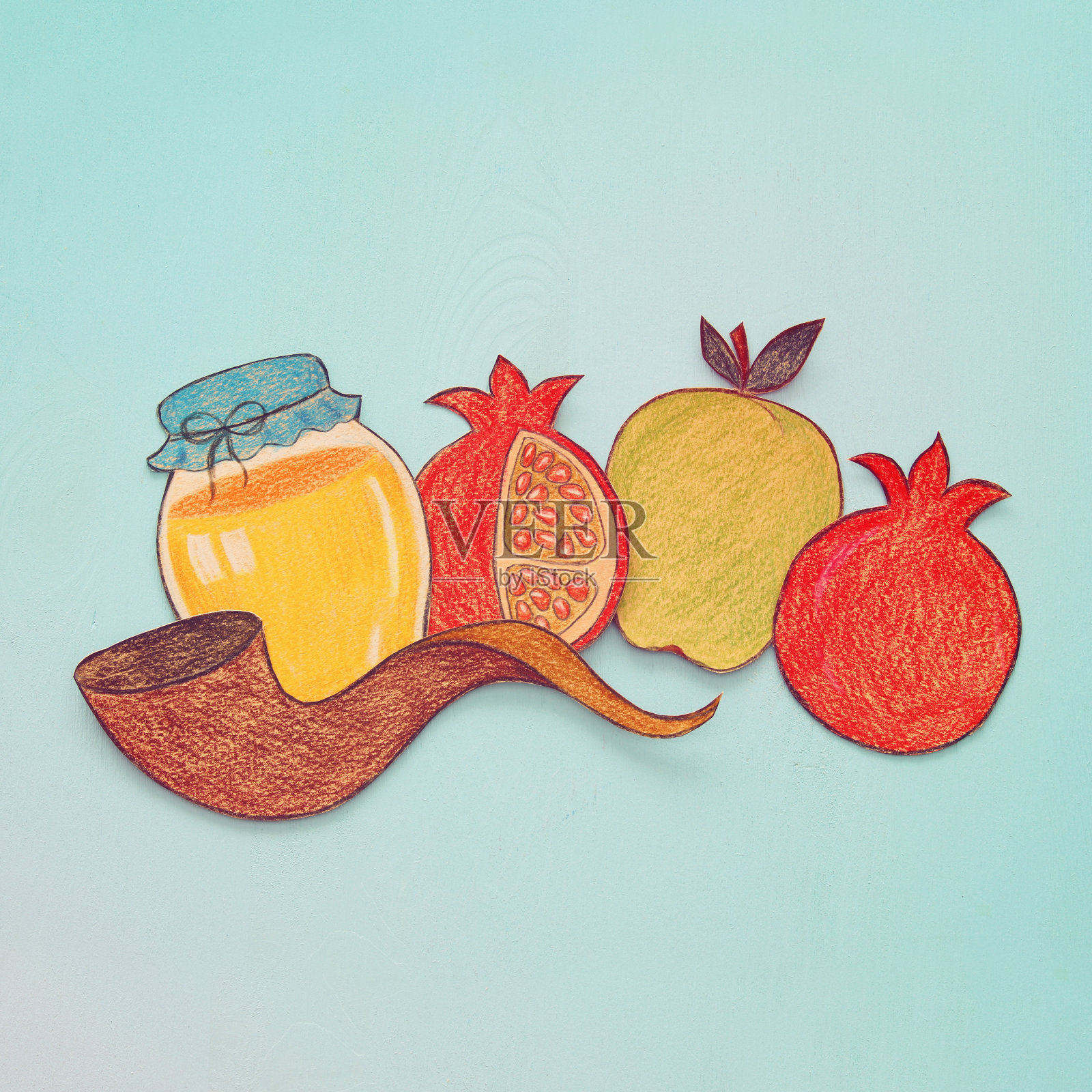 犹太新年的概念。传统符号形状从纸上剪下来，然后涂上颜料。插画图片素材