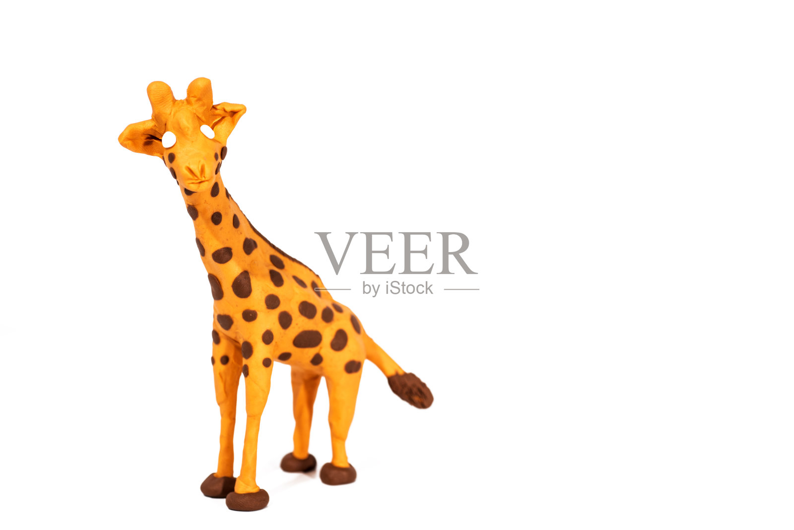 橡皮泥艺术品。手工制作的长颈鹿。抽象的孤立的照片。照片摄影图片